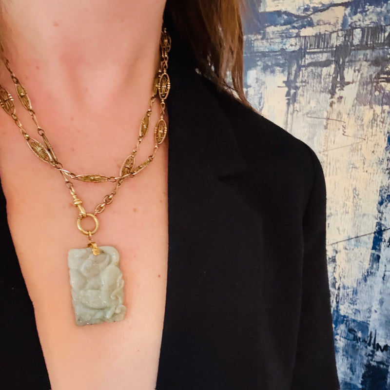 Prowling Lion Carved Jade Pendant