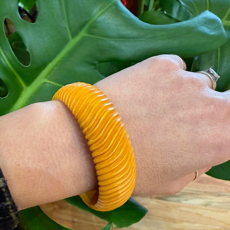 Chunky Orange Bakelite Bangle Carved with Wavy Design