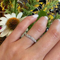 Chic & Sleek Seven Diamond Platinum Wedding Band