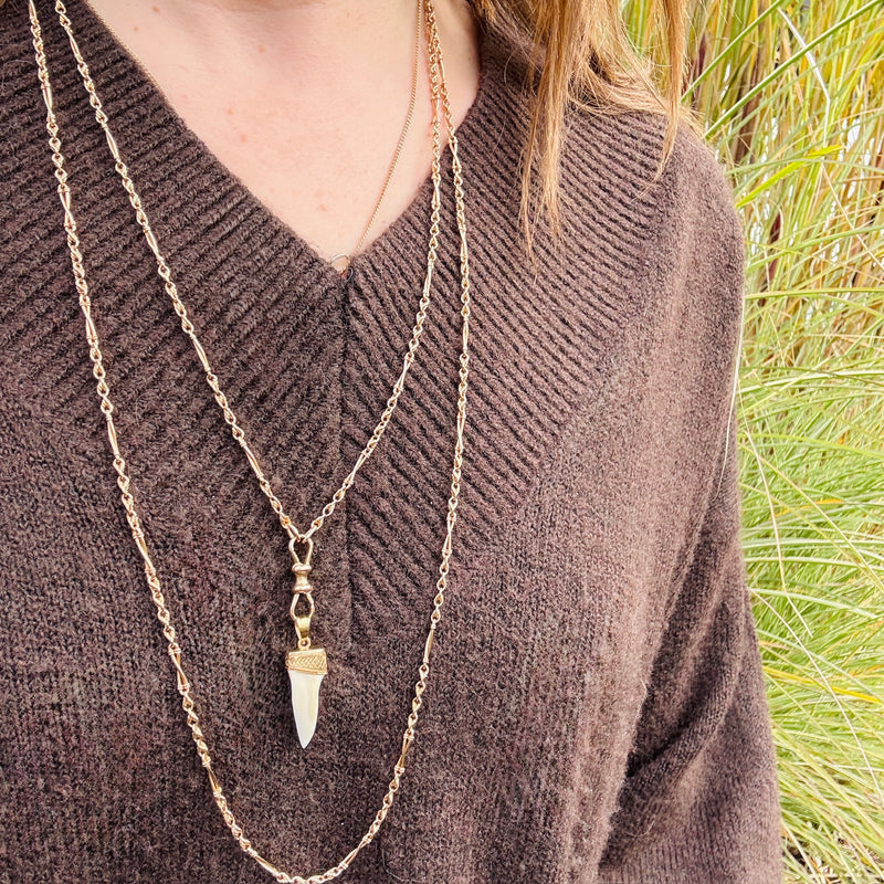 Gold Capped Tooth Charm from Ancient Influences