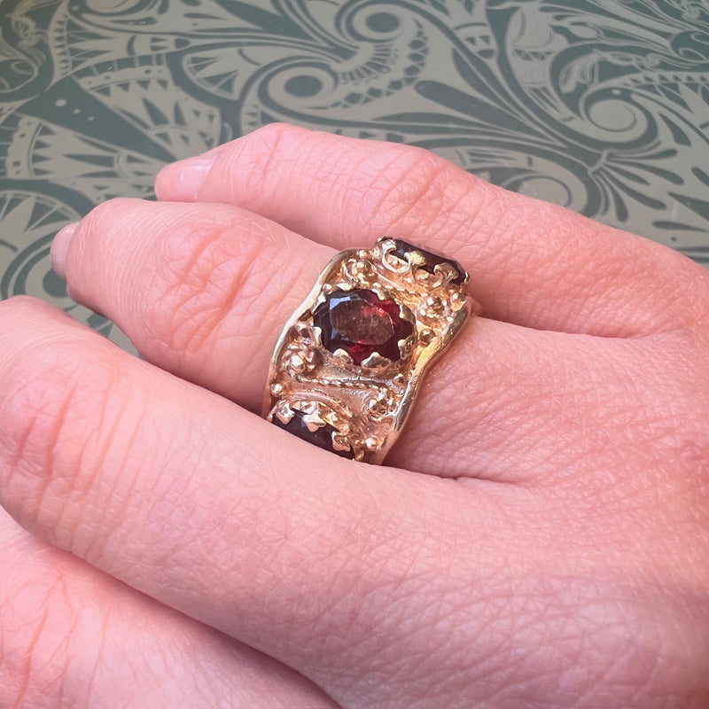 Ornate Garnet-Studded Wide Gold Band