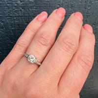 Elegant Platinum Engagement Ring with Baguette Accents