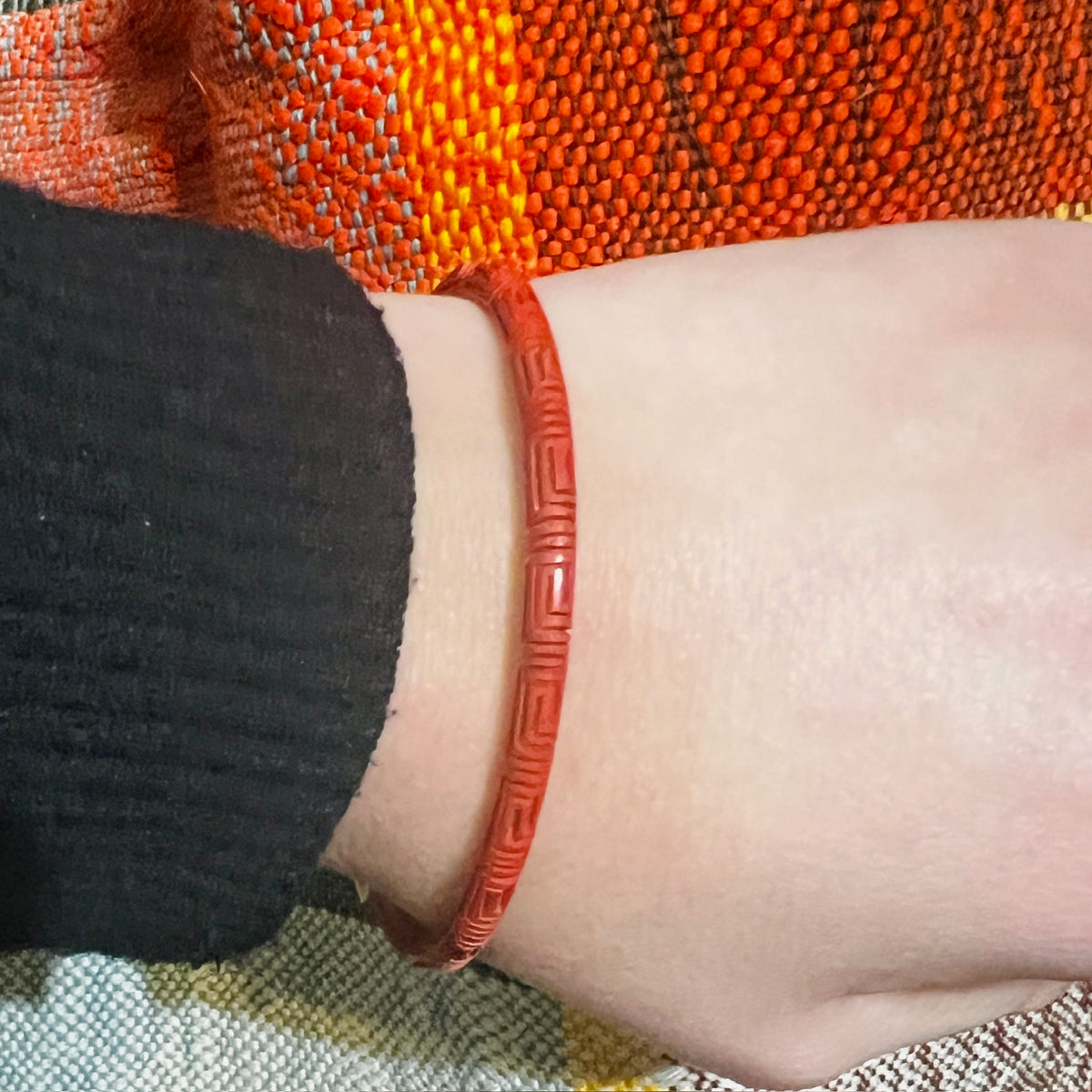 Slender Scarlet Cinnabar Bangle with Carved Meander