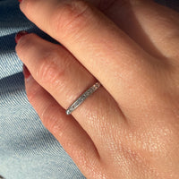 Sparkly Diamonds in Exquisitely Modeled Platinum Band