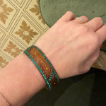 Carved Celluloid Bangle with Green & Orange Stones