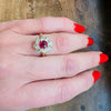 Smouldering Oval Ruby in Diamond Halo Ring