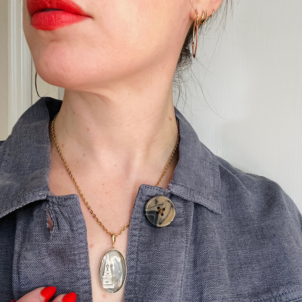 Somber Miniature Painting in Gold Pendant