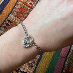 Repoussé Flower Heart Lock Bracelet by Walter Lampl