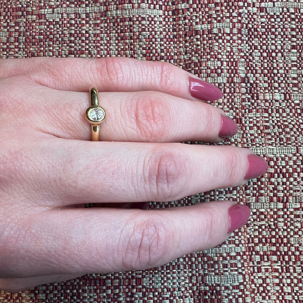 Oval Diamond Bezel Set in Buttery Gold Solitaire Ring