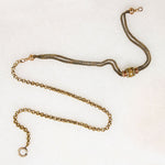 A segment of fancy Victorian foxtail punctuates a gorgeous flattened curb in this superb 14k gold married chain necklace. One end of the vintage curb chain ends with a watch hook. The other ends in a short segment of double foxtail chain with domed terminals displaying a t-bar and watch hook drop. This fabulous necklace fastens in the front; the double watch hooks will display your favorite bits &amp; bobs to perfection. Ingredients circa 1860 to 1940.  From the Married Chains Collection by Ancient Influenc