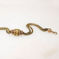 A segment of fancy Victorian foxtail punctuates a gorgeous flattened curb in this superb 14k gold married chain necklace. One end of the vintage curb chain ends with a watch hook. The other ends in a short segment of double foxtail chain with domed terminals displaying a t-bar and watch hook drop. This fabulous necklace fastens in the front; the double watch hooks will display your favorite bits &amp; bobs to perfection. Ingredients circa 1860 to 1940.  From the Married Chains Collection by Ancient Influenc