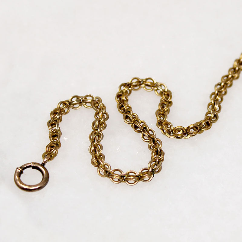 A segment of fancy Victorian foxtail punctuates a gorgeous flattened curb in this superb 14k gold married chain necklace. One end of the vintage curb chain ends with a watch hook. The other ends in a short segment of double foxtail chain with domed terminals displaying a t-bar and watch hook drop. This fabulous necklace fastens in the front; the double watch hooks will display your favorite bits &amp; bobs to perfection. Ingredients circa 1860 to 1940.  From the Married Chains Collection by Ancient Influenc