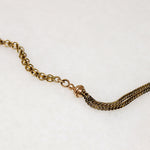 A segment of fancy Victorian foxtail punctuates a gorgeous flattened curb in this superb 14k gold married chain necklace. One end of the vintage curb chain ends with a watch hook. The other ends in a short segment of double foxtail chain with domed terminals displaying a t-bar and watch hook drop. This fabulous necklace fastens in the front; the double watch hooks will display your favorite bits &amp; bobs to perfection. Ingredients circa 1860 to 1940.  From the Married Chains Collection by Ancient Influenc