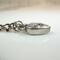 Repoussé Flower Heart Lock Bracelet by Walter Lampl