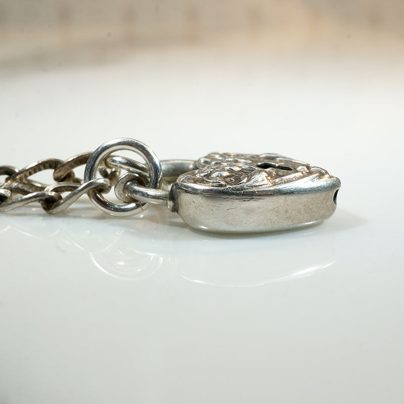 Repoussé Flower Heart Lock Bracelet by Walter Lampl