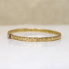 Engraved Gold Bangle Bracelet with Single Diamond