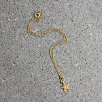 Delicate Gold Bracelet with Diamond-Set Star Charm