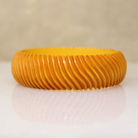 Chunky Orange Bakelite Bangle Carved with Wavy Design