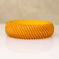 Chunky Orange Bakelite Bangle Carved with Wavy Design