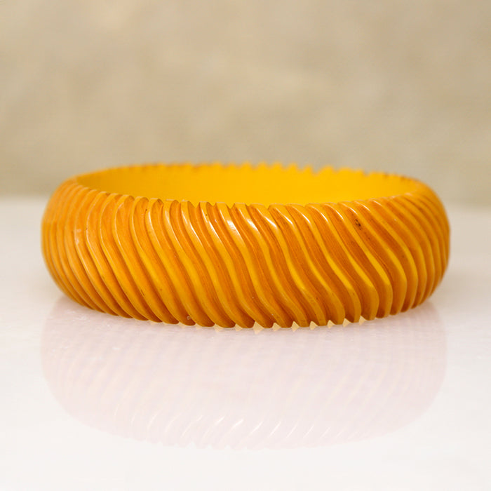Chunky Orange Bakelite Bangle Carved with Wavy Design