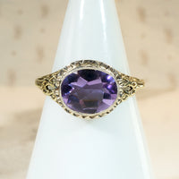 Brilliant Buff Top Cut Amethyst in Gold Filigree Solitaire