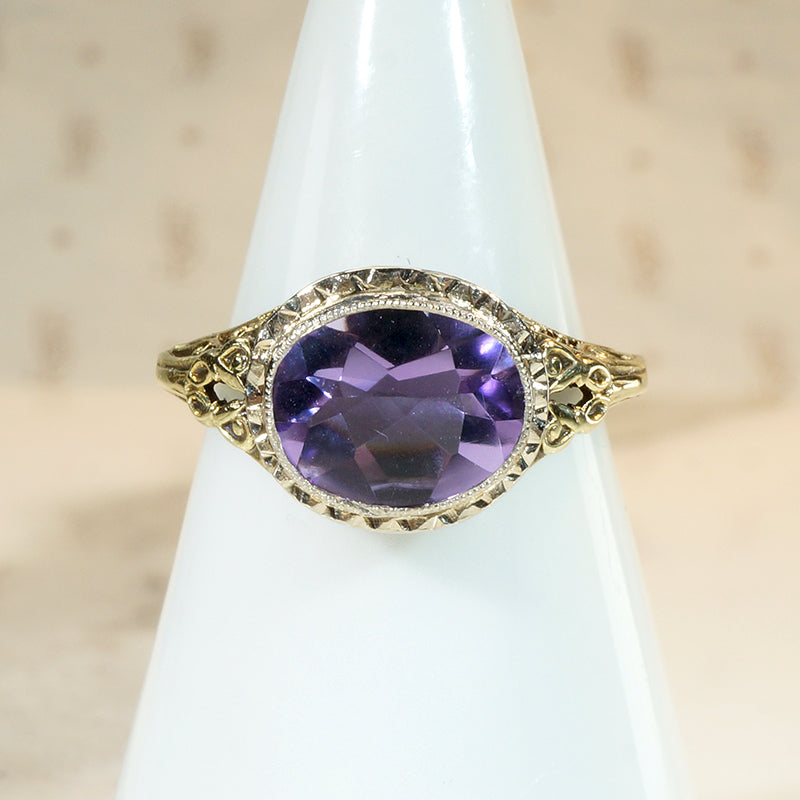 Brilliant Buff Top Cut Amethyst in Gold Filigree Solitaire