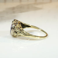 Brilliant Buff Top Cut Amethyst in Gold Filigree Solitaire