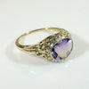 Brilliant Buff Top Cut Amethyst in Gold Filigree Solitaire