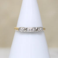 Five Pretty Diamonds in Two-Tone Gold Wedding Band