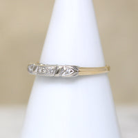 Five Pretty Diamonds in Two-Tone Gold Wedding Band