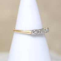 Five Pretty Diamonds in Two-Tone Gold Wedding Band