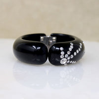 Black Celluloid Clamper Bracelet with Sparkling Fireworks