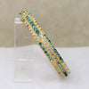 White & Aqua Rhinestones in Ivory-Colored Celluloid Bangle