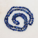 Lapis Lazuli Nugget Beads on Blue Silk