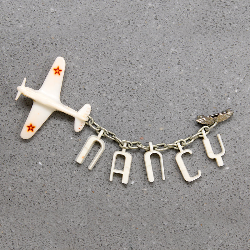 Nancy's Sweetheart WWII Celluloid Army Plane Brooch