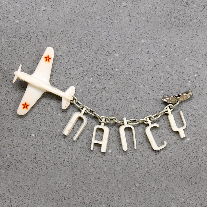 Nancy's Sweetheart WWII Celluloid Army Plane Brooch