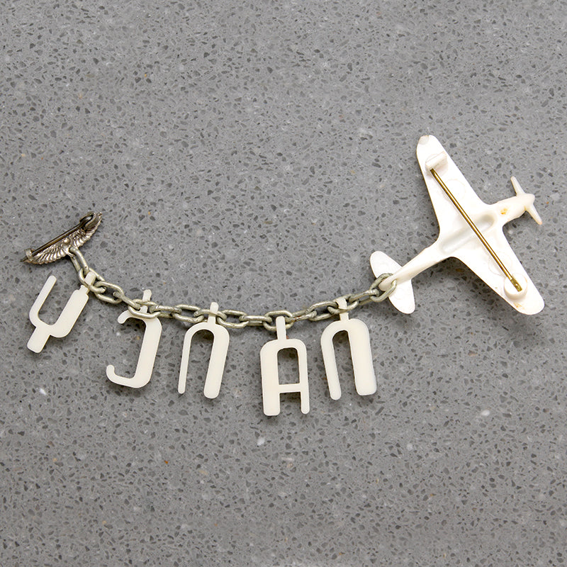 Nancy's Sweetheart WWII Celluloid Army Plane Brooch