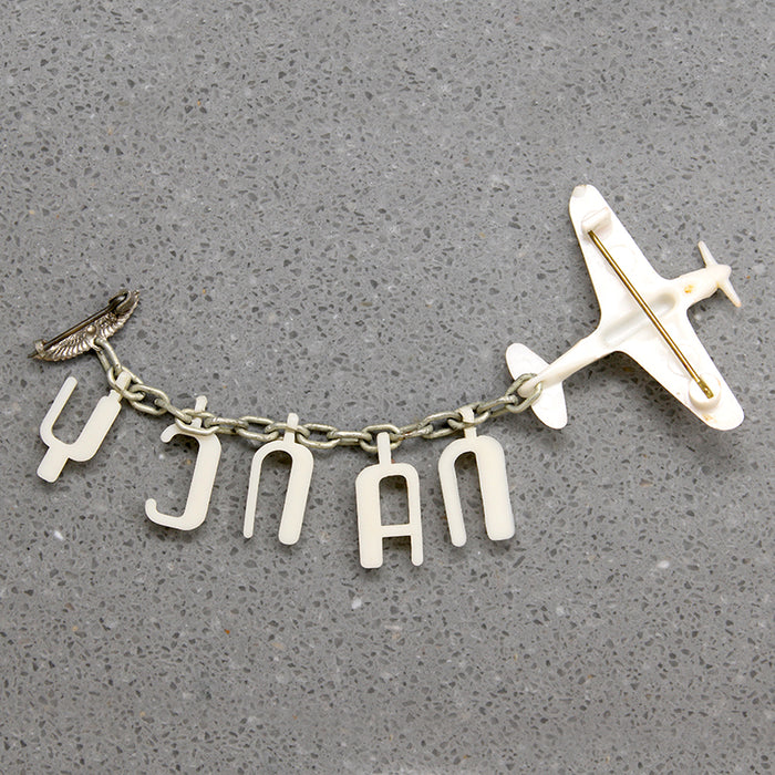 Nancy's Sweetheart WWII Celluloid Army Plane Brooch