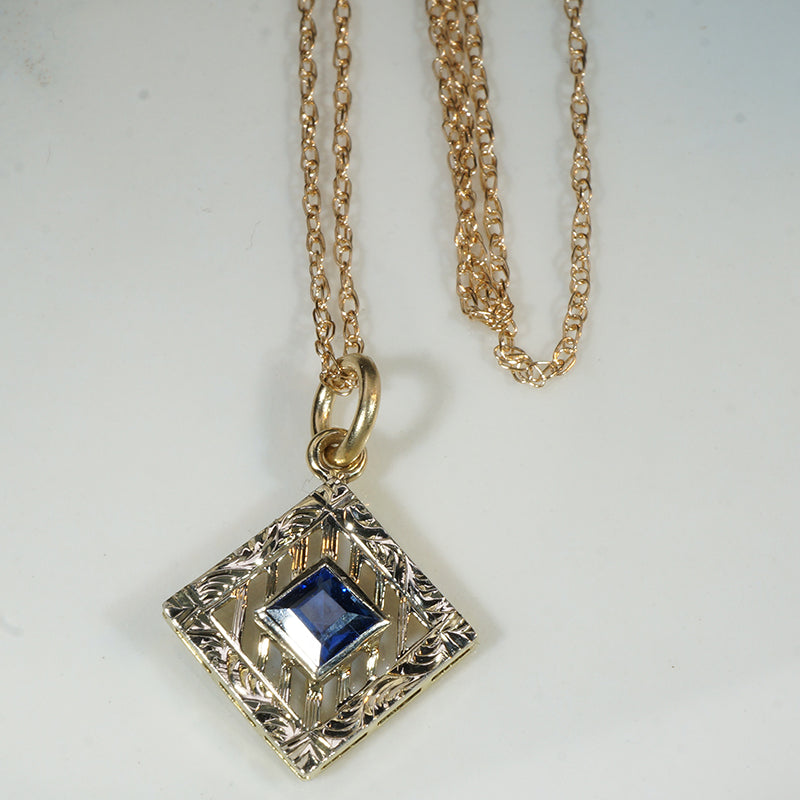 Filigreed & Engraved Gold Pendant with Sapphire