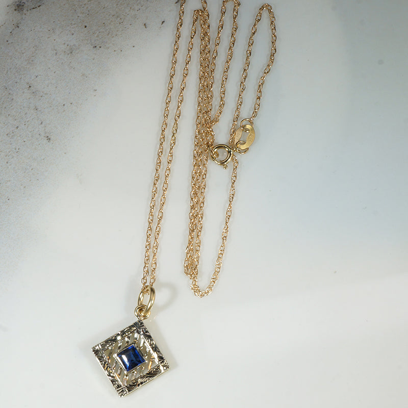 Filigreed & Engraved Gold Pendant with Sapphire