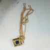 Filigreed & Engraved Gold Pendant with Sapphire