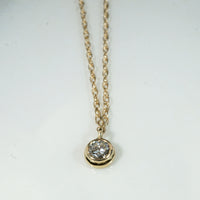 Delightful Diamond Solitaire in Gold Bezel Pendant