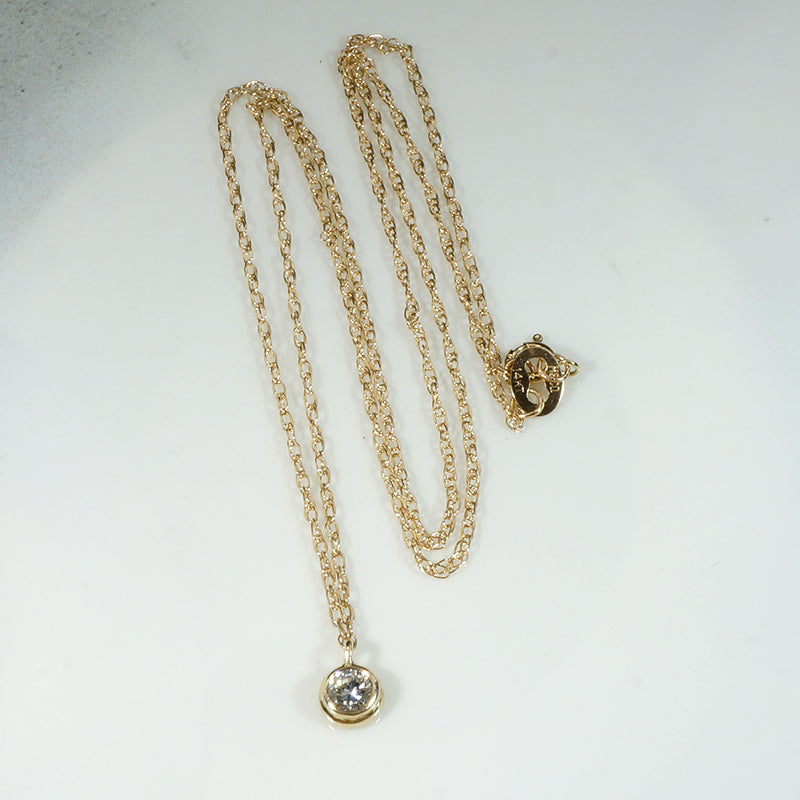Delightful Diamond Solitaire in Gold Bezel Pendant