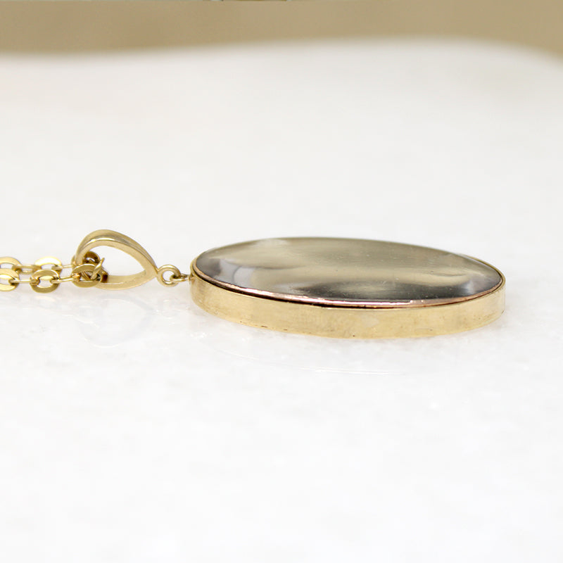 Somber Miniature Painting in Gold Pendant