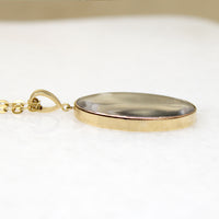 Somber Miniature Painting in Gold Pendant