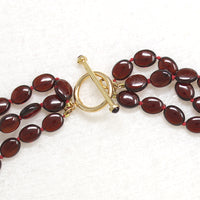 Four Strand Garnet Beads with Gold & Garnet Clasp