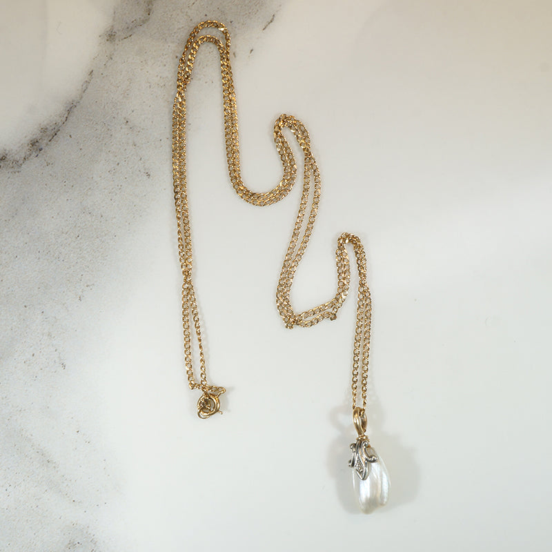 Baroque Pearl Pendant Capped in Gold, Platinum & Diamond