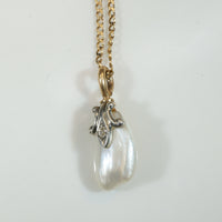 Baroque Pearl Pendant Capped in Gold, Platinum & Diamond