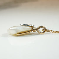 Baroque Pearl Pendant Capped in Gold, Platinum & Diamond