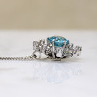 Natural Blue Zircon in Diamond-Set White Gold Pendant